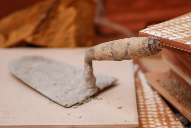 Trowel which is a tool used in construction fir concrete. Concrete is one out of the 10 Example of Recyclable Materials